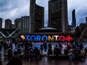 People Gathered in Front of Toronto Freestanding Signage