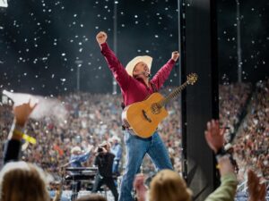 Garth Brooks performing live on stage during a concert