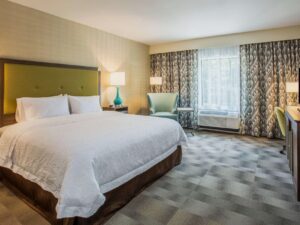 Cozy hotel room at Hampton Inn & Suites Yonkers with comfortable bedding