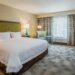 Cozy hotel room at Hampton Inn & Suites Yonkers with comfortable bedding