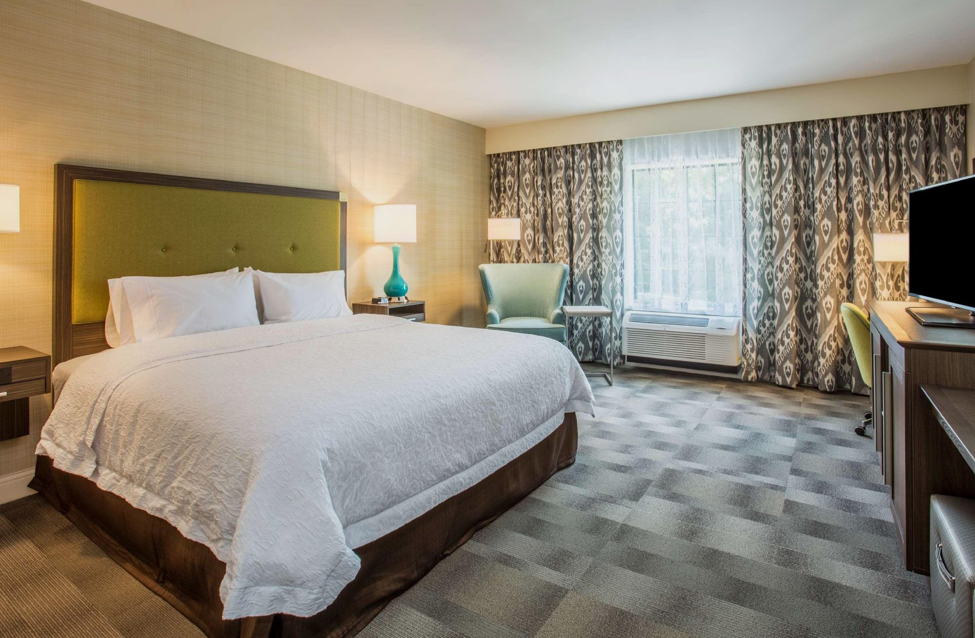 Cozy hotel room at Hampton Inn & Suites Yonkers with comfortable bedding