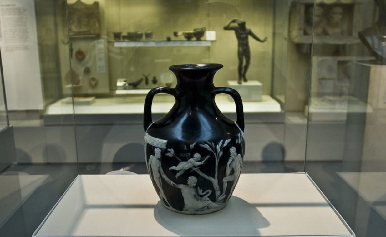 Photograph of the Portland Vase at the British Museum, showcasing intricate Roman glasswork and detailed classical design