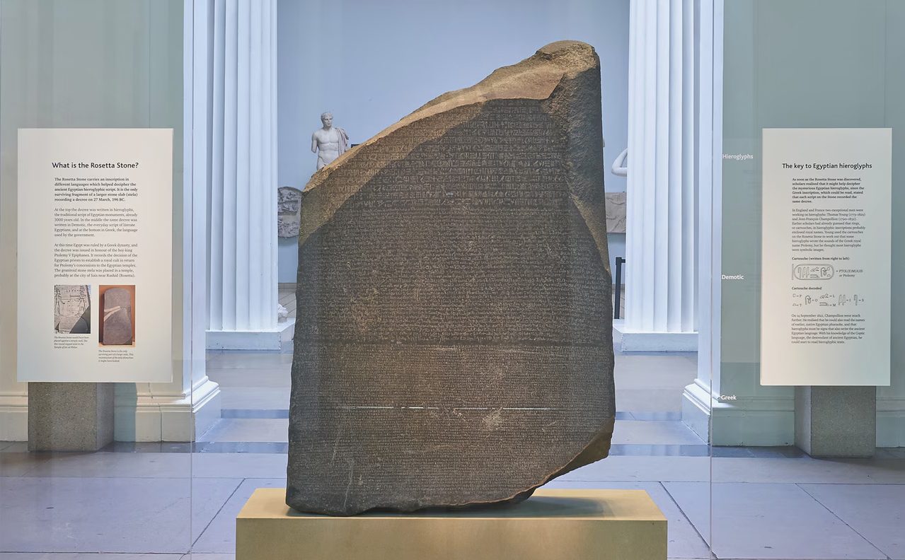 Photograph of the Rosetta Stone with three inscriptions_ Greek, Demotic, and Egyptian hieroglyphs.